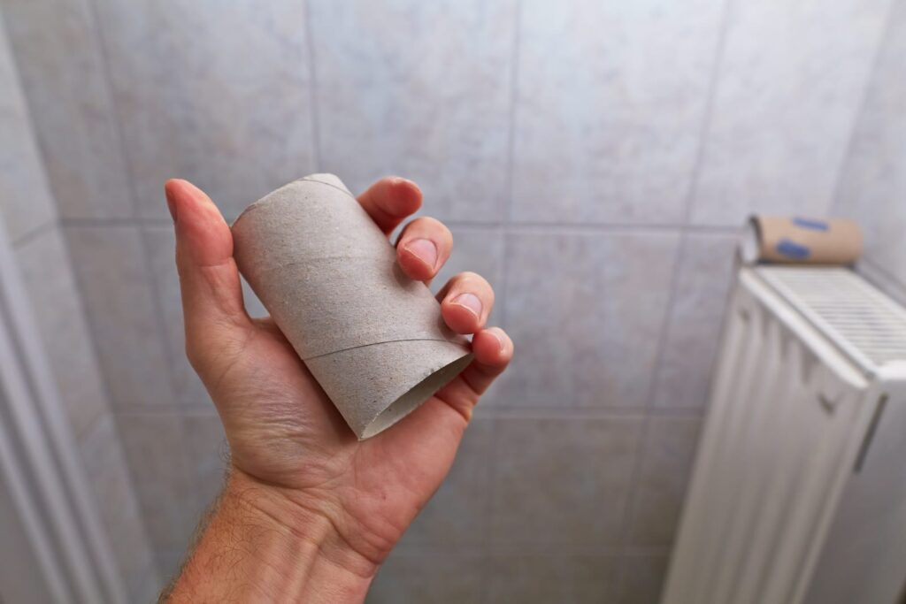 Holding empty toilet paper roll