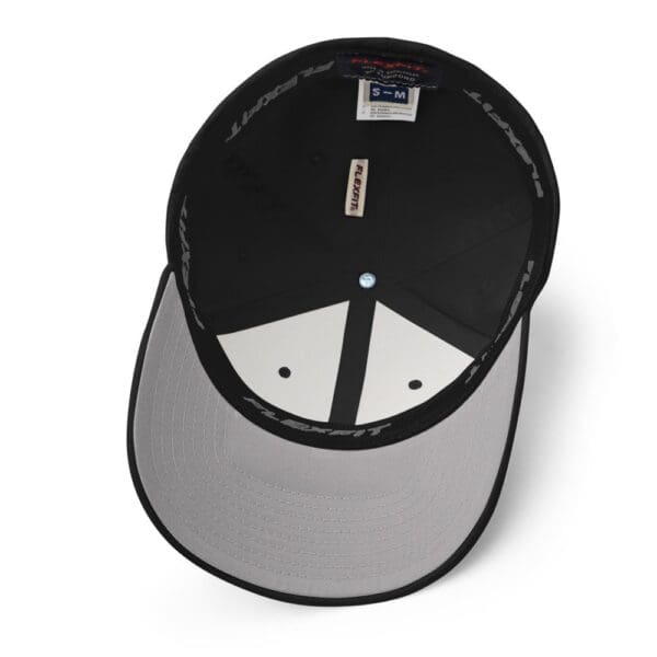 A black and white Modern Warrior Flex Fit Structured Twill Cap.