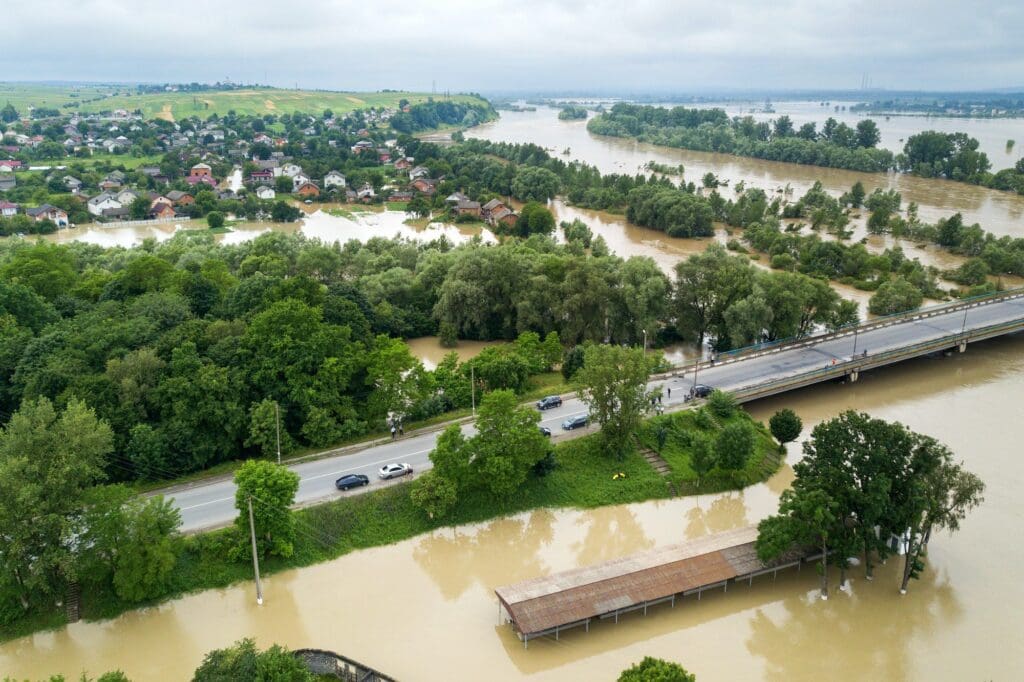 Aerial view of flooded houses with dirty water of Dnister river in Halych town, western Ukraine during evacuation