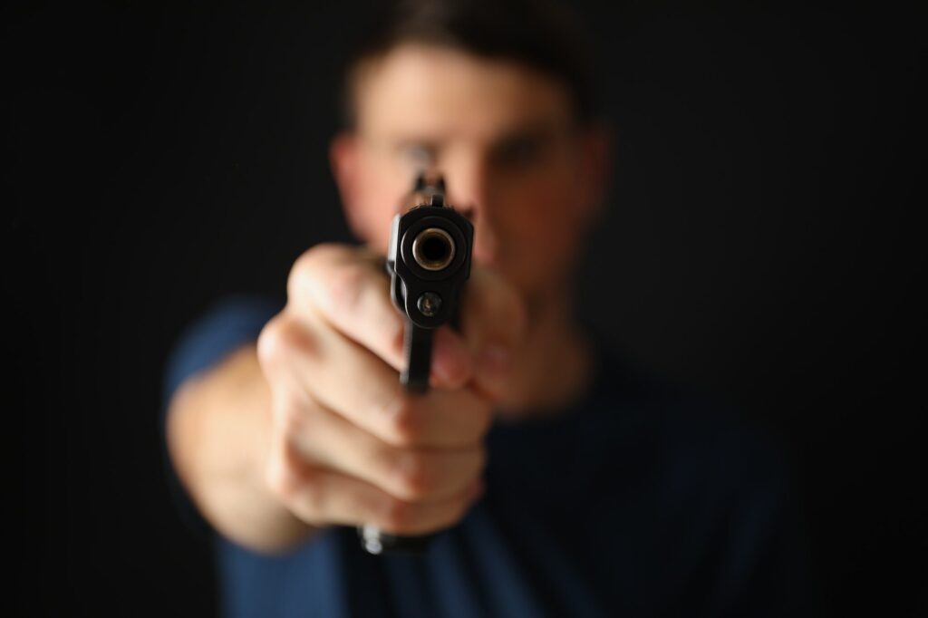 Man hold pistol. Selective focus. Self defense weapon
