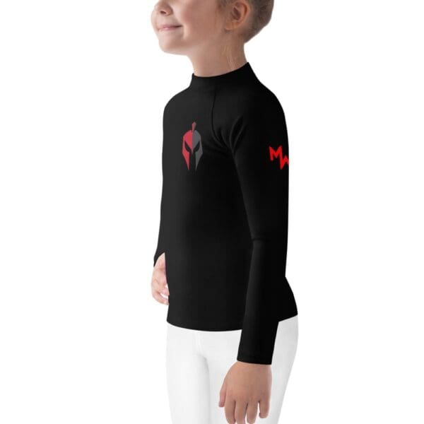 A little MW Combatives kid sporting a black and red MW Combatives Kids Rash Guard.