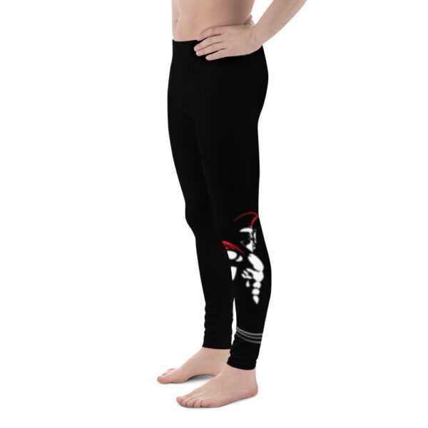 A man wearing MW Combatives Men's Spats, black leggings with red and white designs.