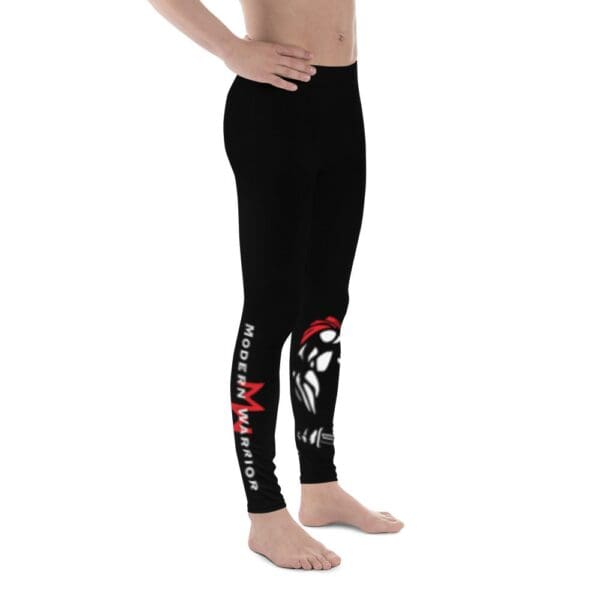 A young boy wearing black MW Combatives Men's Spats leggings with a red and white design.