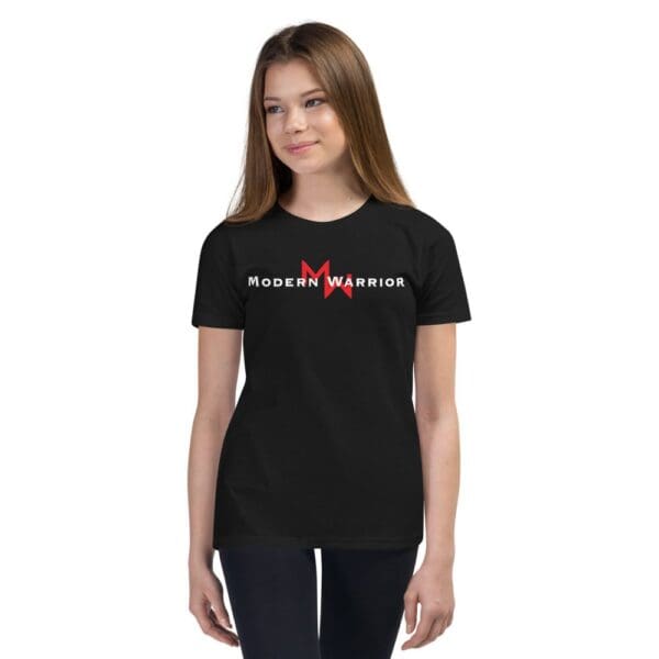 A young girl wearing a MW Combatives Youth Short Sleeve T-Shirt.