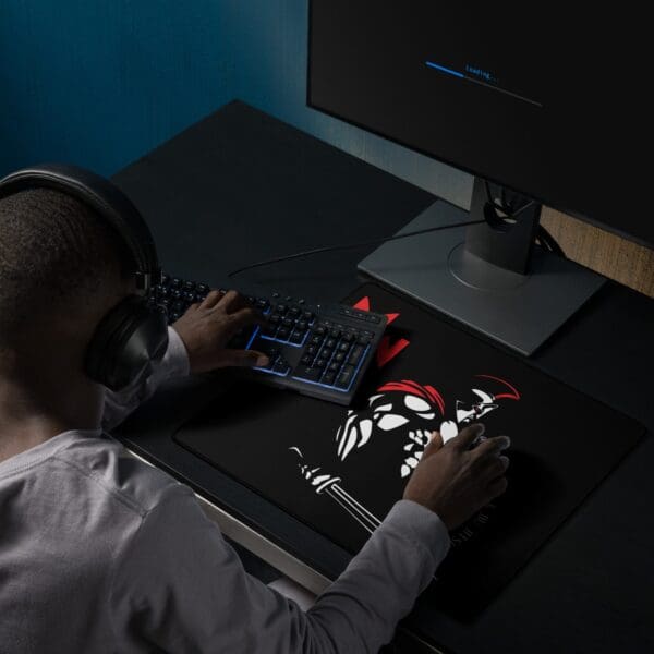 A man at a desk using a MWC Gaming mouse pad.