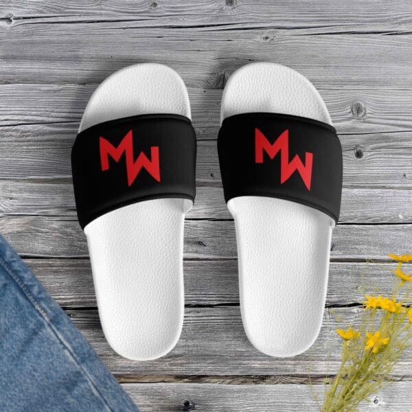 Modern black and red Modern Warrior Slides featuring the letter m.