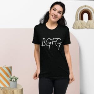 A woman wearing a black Created Series Women's BGFG T-shirt.