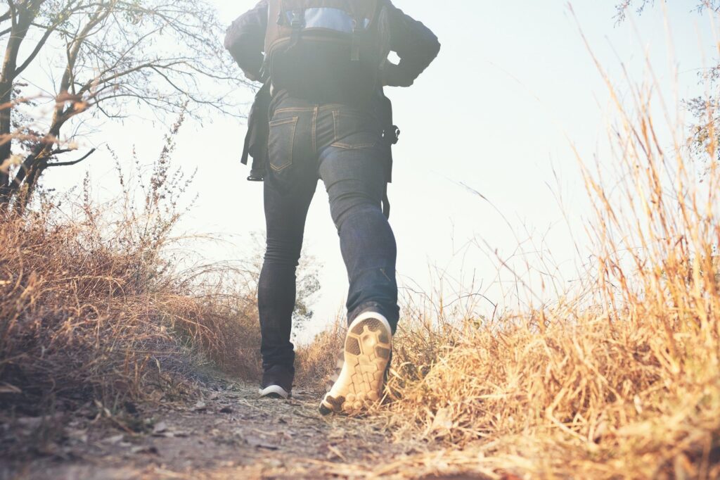 Man Walking with Backpack an important part of Prepper Gear