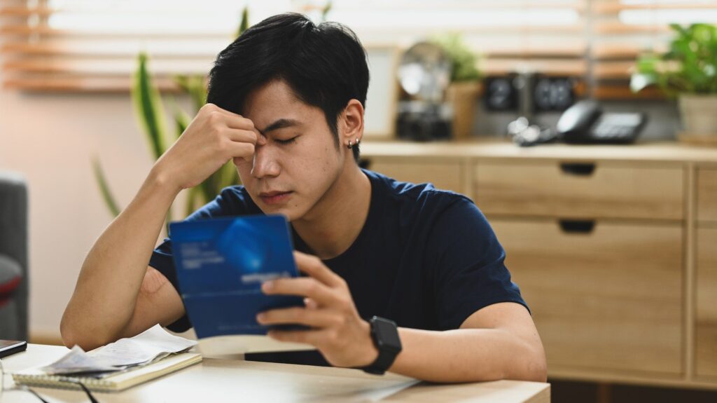 Image of stressed man having financial problem, anxiety about debt.
