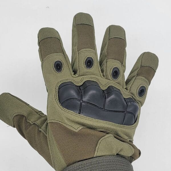 Tactical gloves with black buttons.