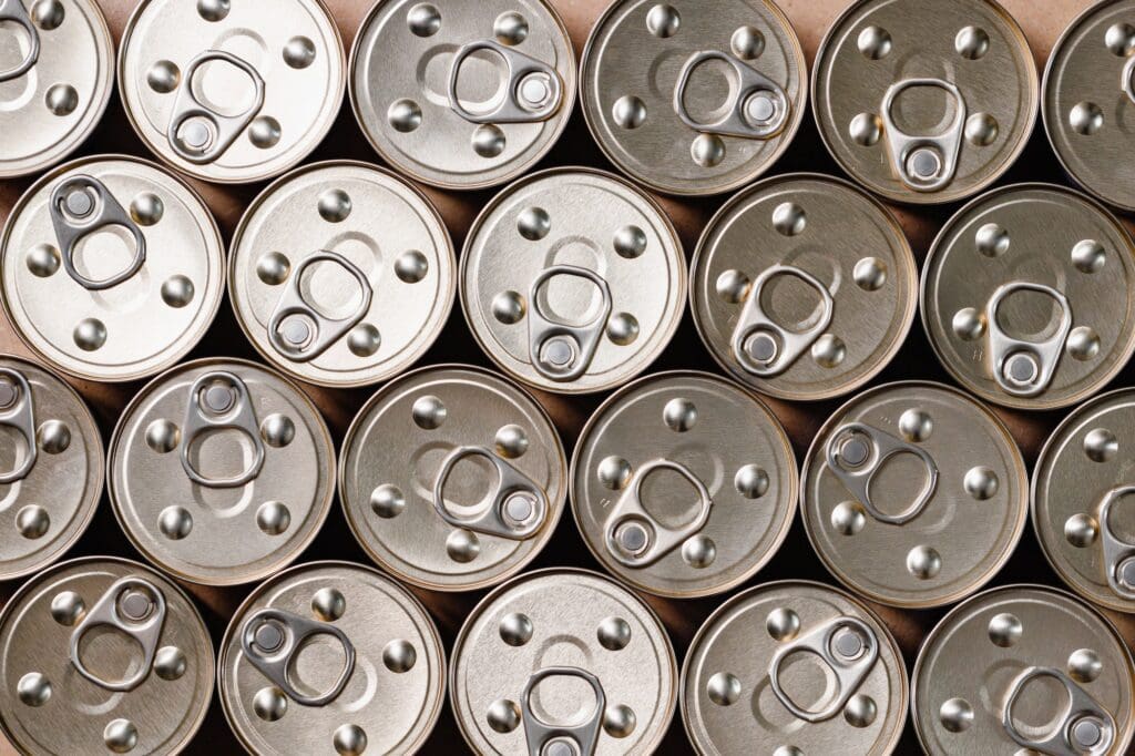 Background of canned food, top view.