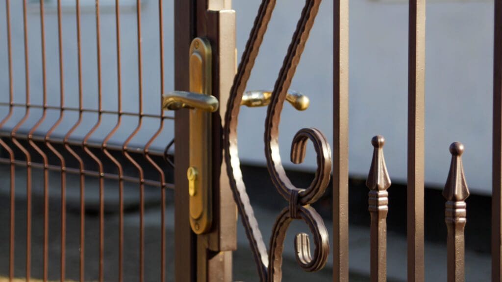 forged decor of forged elements for metal gates. Forged metal fence in retro style. Gate with forged