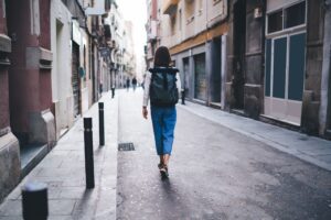 Traveler woman walking in city